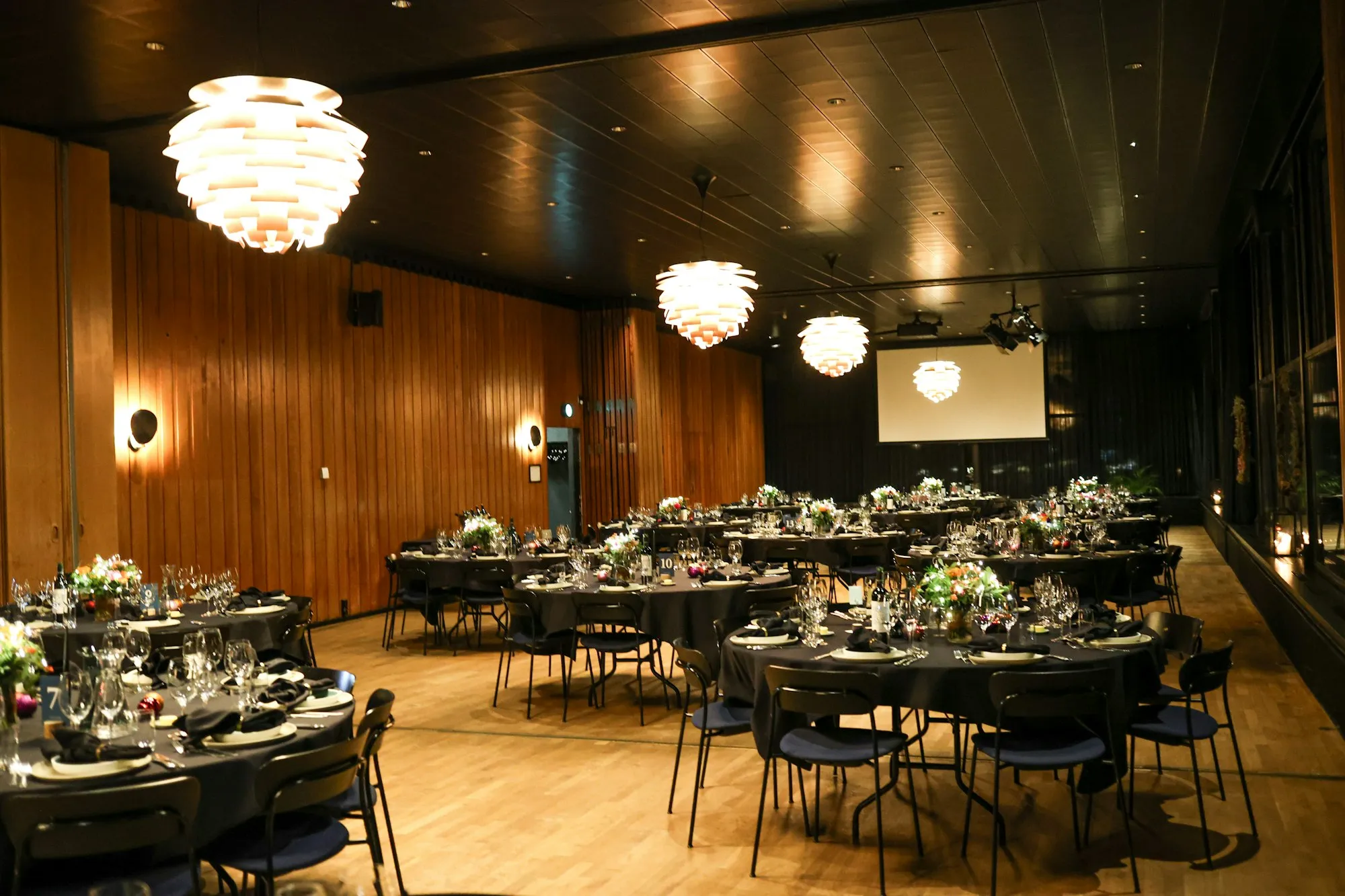 Banquet hall set with round tables for an event