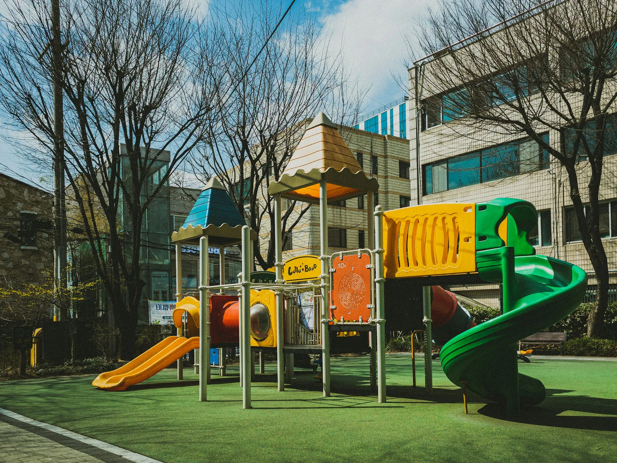 Outdoor play structure in front of a building