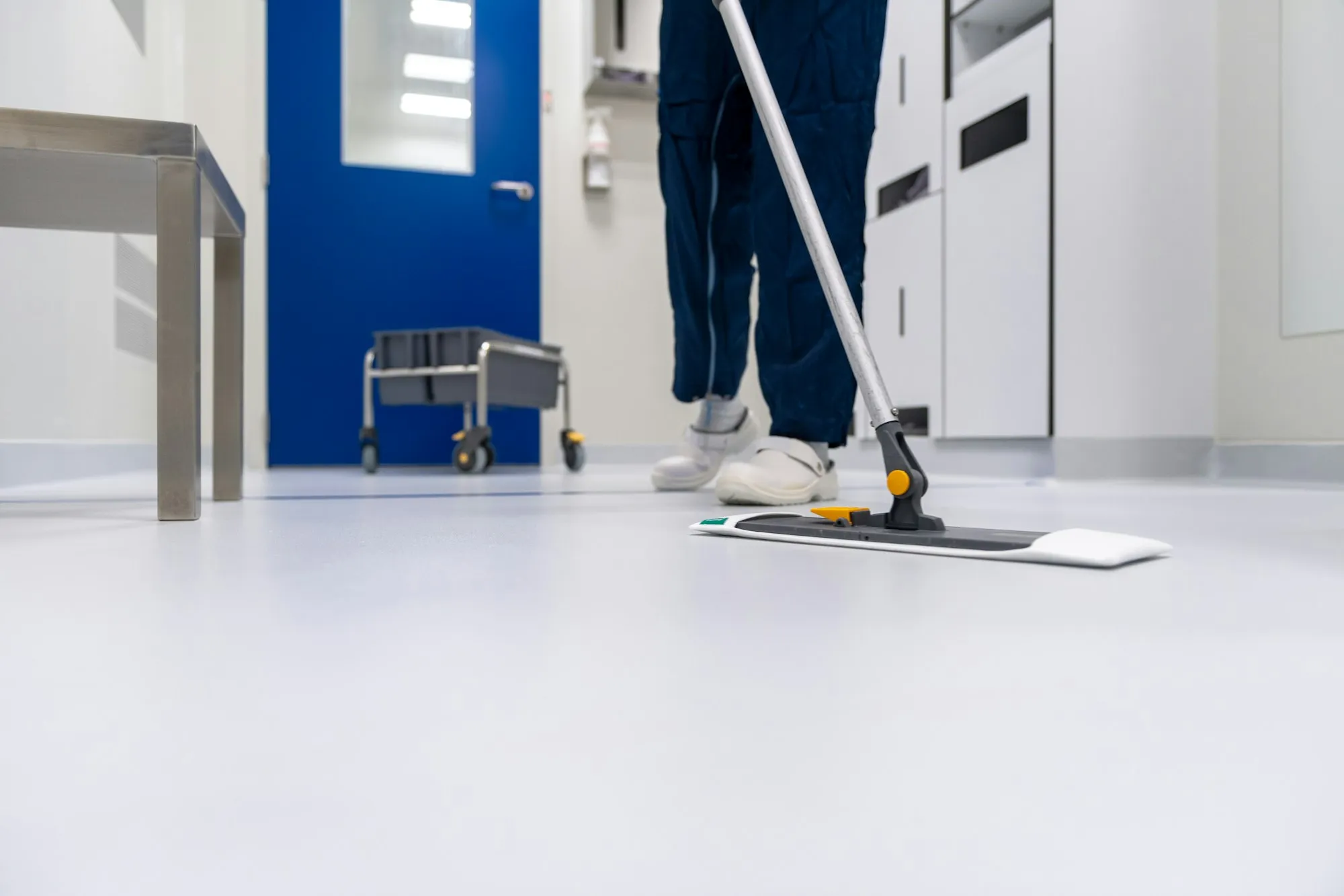 Floor being mopped in a clean commercial space