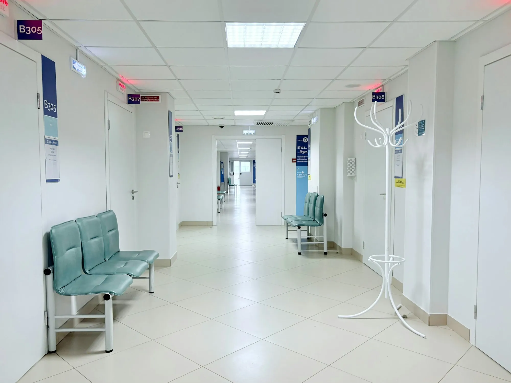 Clean, bright clinic corridor with seating