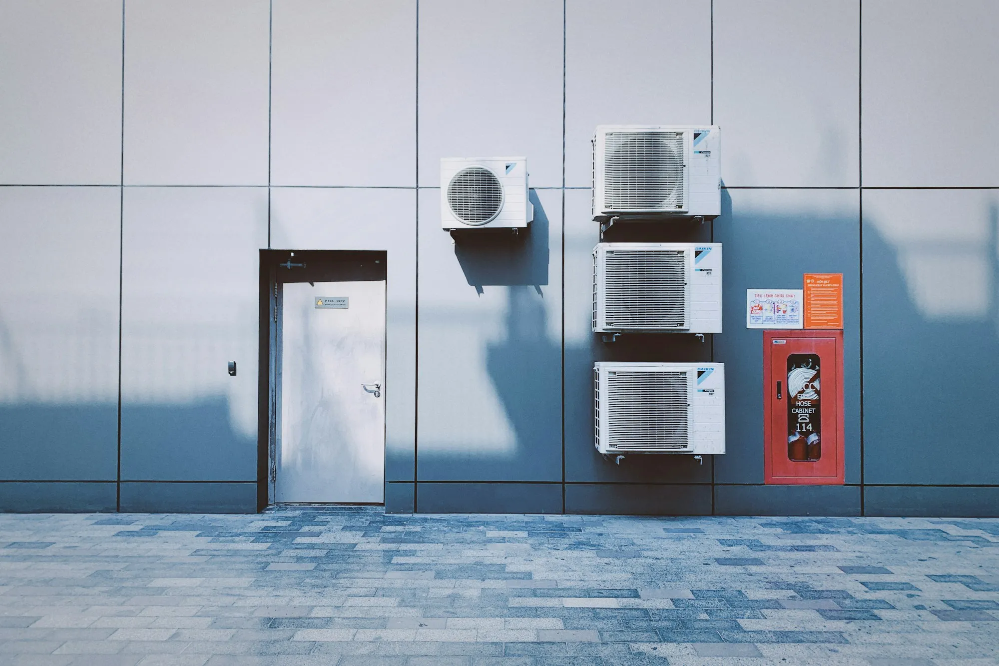 Air conditioning units mounted on a building wall