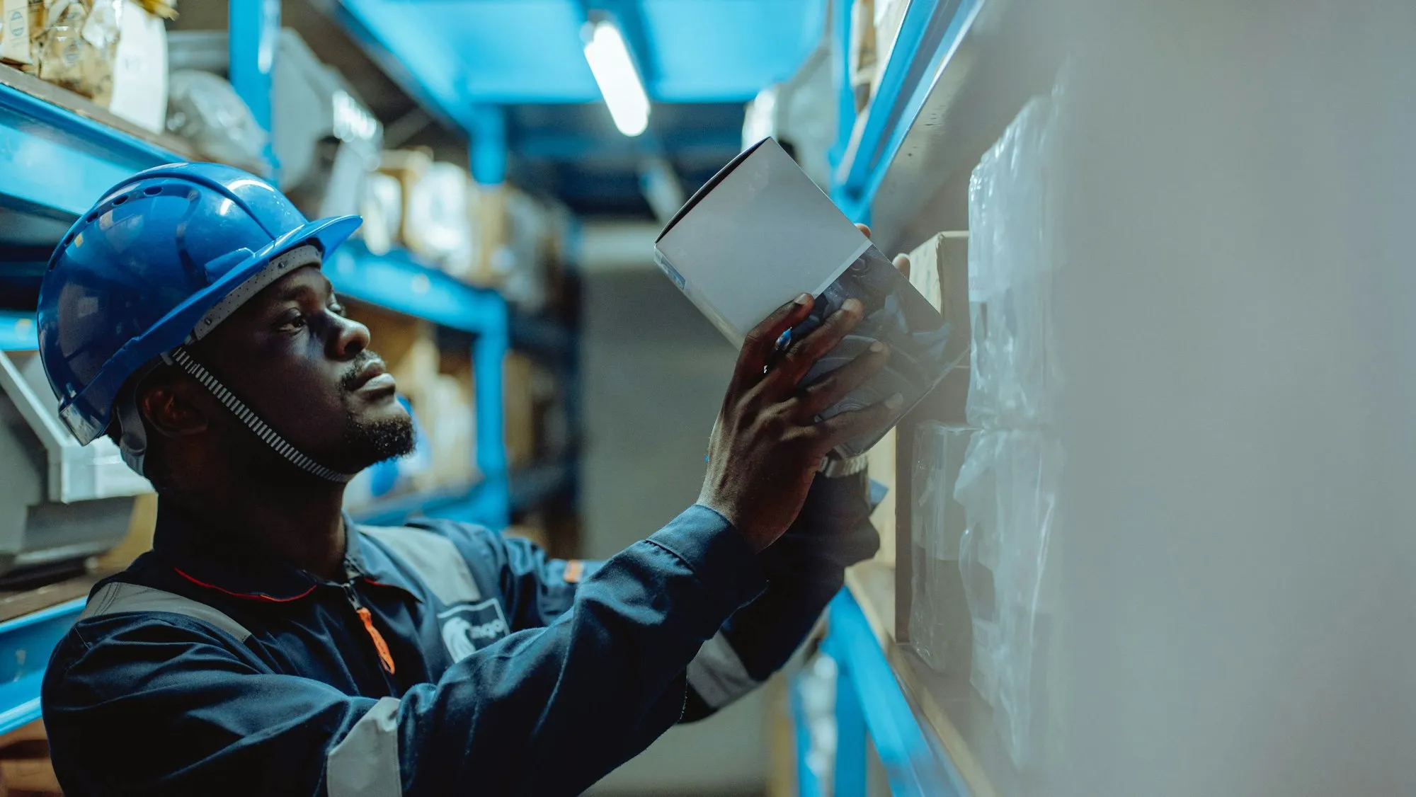 Technician inspecting equipment and recording results