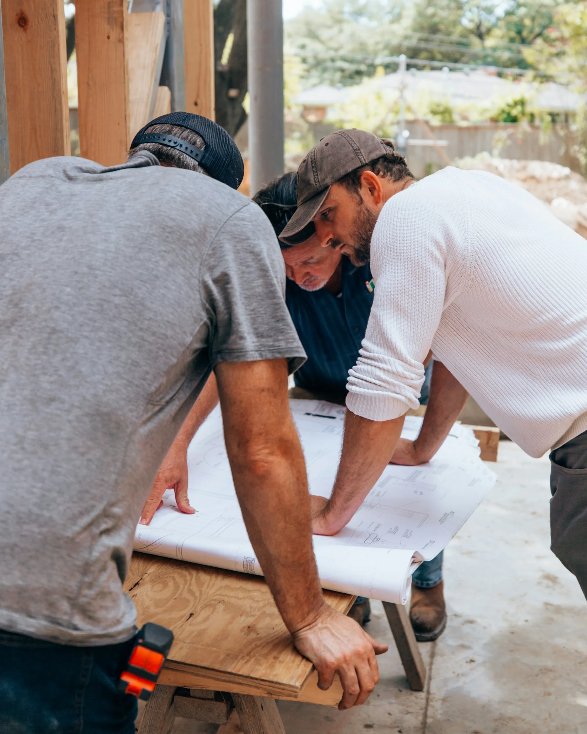 Supervisors reviewing plans on site
